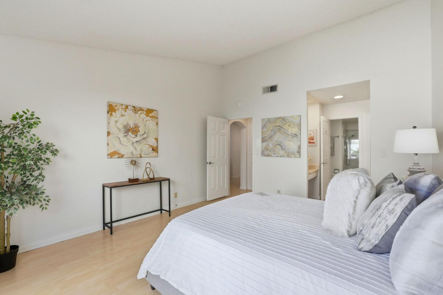 2327 Farmcrest Street Milpitas, CA 95035 - Photo 19 of 36 a bedroom with a bed and a painting on the wall