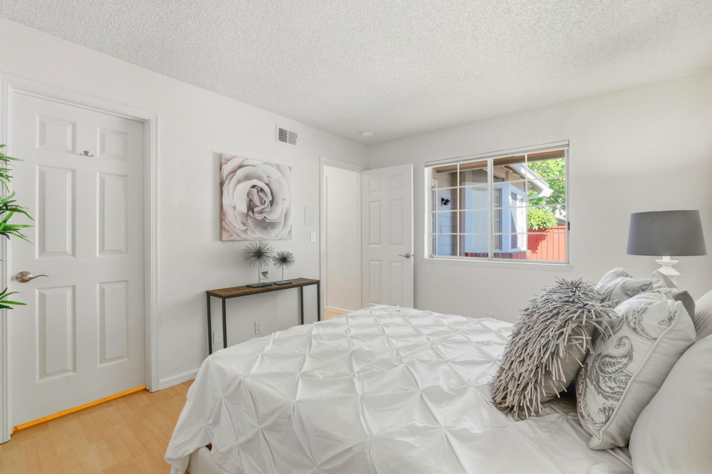 2327 Farmcrest Street Milpitas, CA 95035 - Photo 22 of 36 a bedroom with a bed and a table