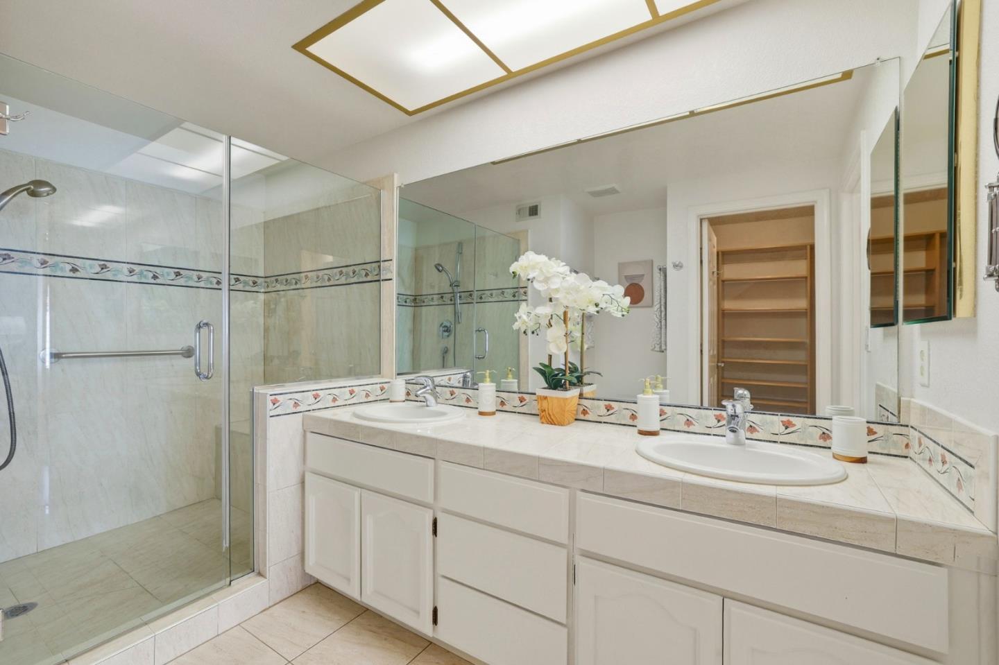 2327 Farmcrest Street Milpitas, CA 95035 - Photo 26 of 36 a bathroom with a double vanity sink mirror and shower