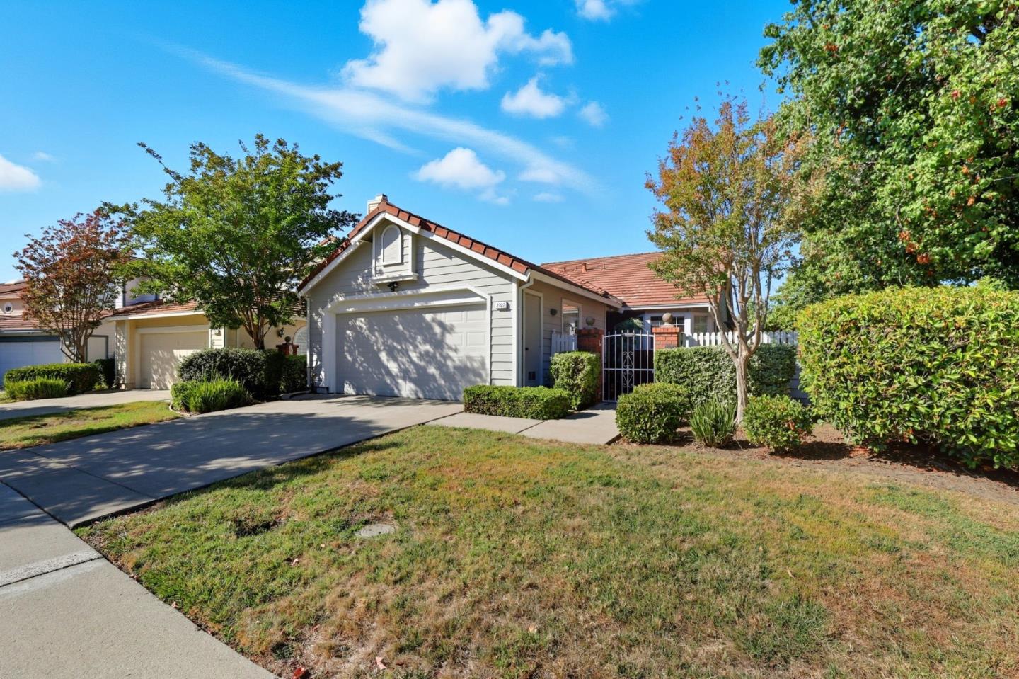 2327 Farmcrest Street Milpitas, CA 95035 - Photo 3 of 36 a front view of a house with a yard