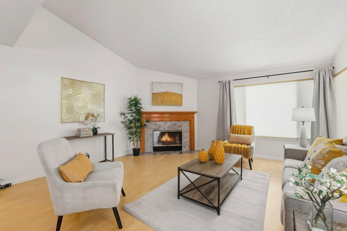 2327 Farmcrest Street Milpitas, CA 95035 - Photo 7 of 36 a living room with furniture and a fireplace