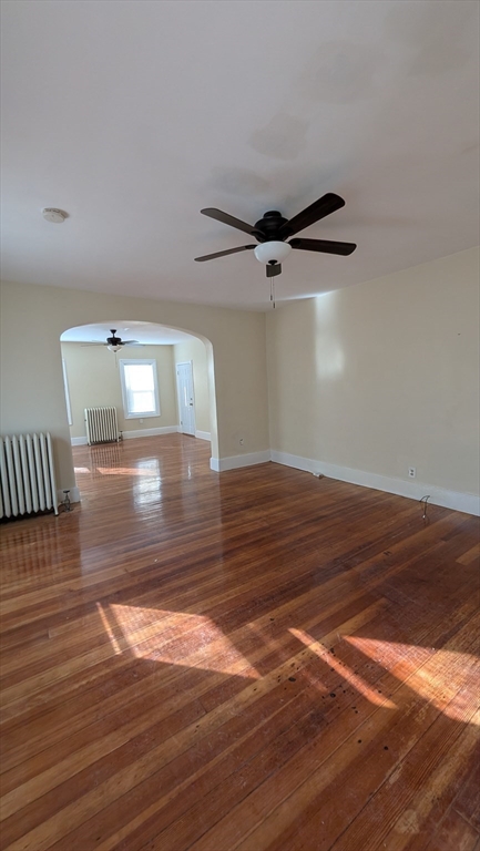 6 Brandon Road, Unit 1 Dudley, MA 01571 - Photo 13 of 14 a view of a room with wooden floor and a ceiling fan