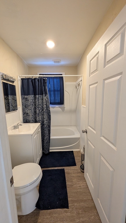 6 Brandon Road, Unit 1 Dudley, MA 01571 - Photo 3 of 14 a bathroom with a toilet a sink and bathtub