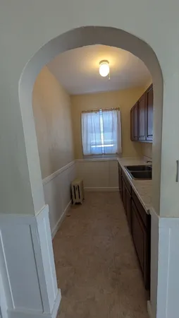 a kitchen with a sink and a stove