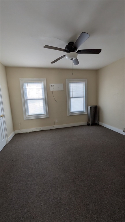 6 Brandon Road, Unit 1 Dudley, MA 01571 - Photo 6 of 14 an empty room with a empty space and windows