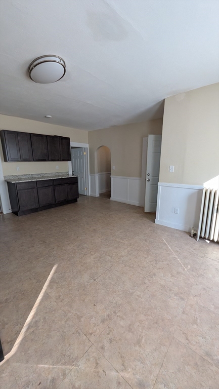 6 Brandon Road, Unit 1 Dudley, MA 01571 - Photo 9 of 14 a view of an empty room with a fireplace