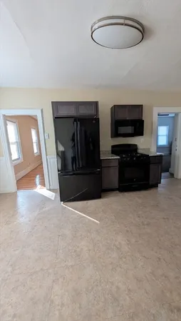 a view of a livingroom with furniture and a flat screen tv