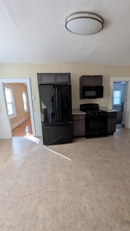 6 Brandon Road, Unit 1 Dudley, MA 01571 - Photo 10 of 14 a view of a livingroom with furniture and a flat screen tv