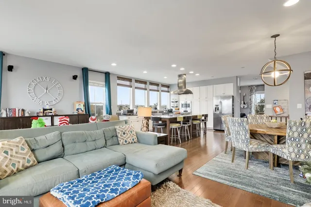 a view of a chairs and table in the balcony