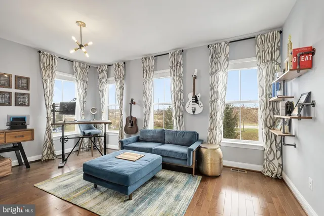 a view of a swimming pool with a patio and a garden