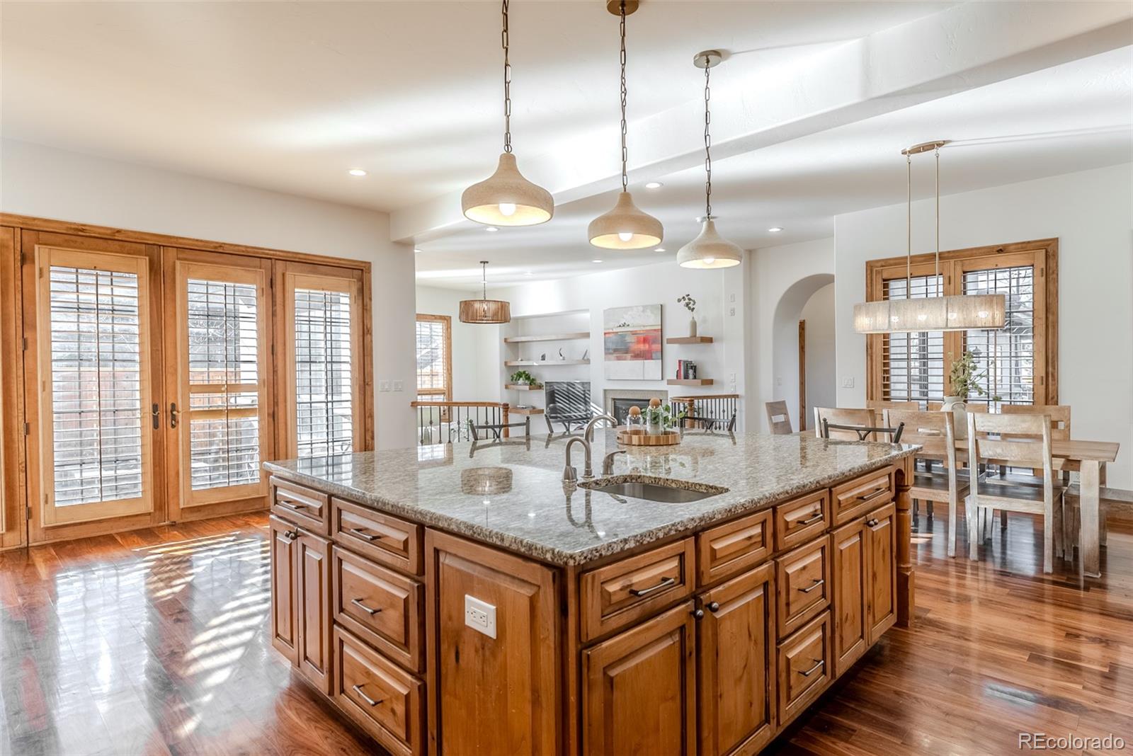 2515 South Fillmore Street Denver, CO 80210 - Photo 11 of 40 a kitchen with counter top space and wooden floor