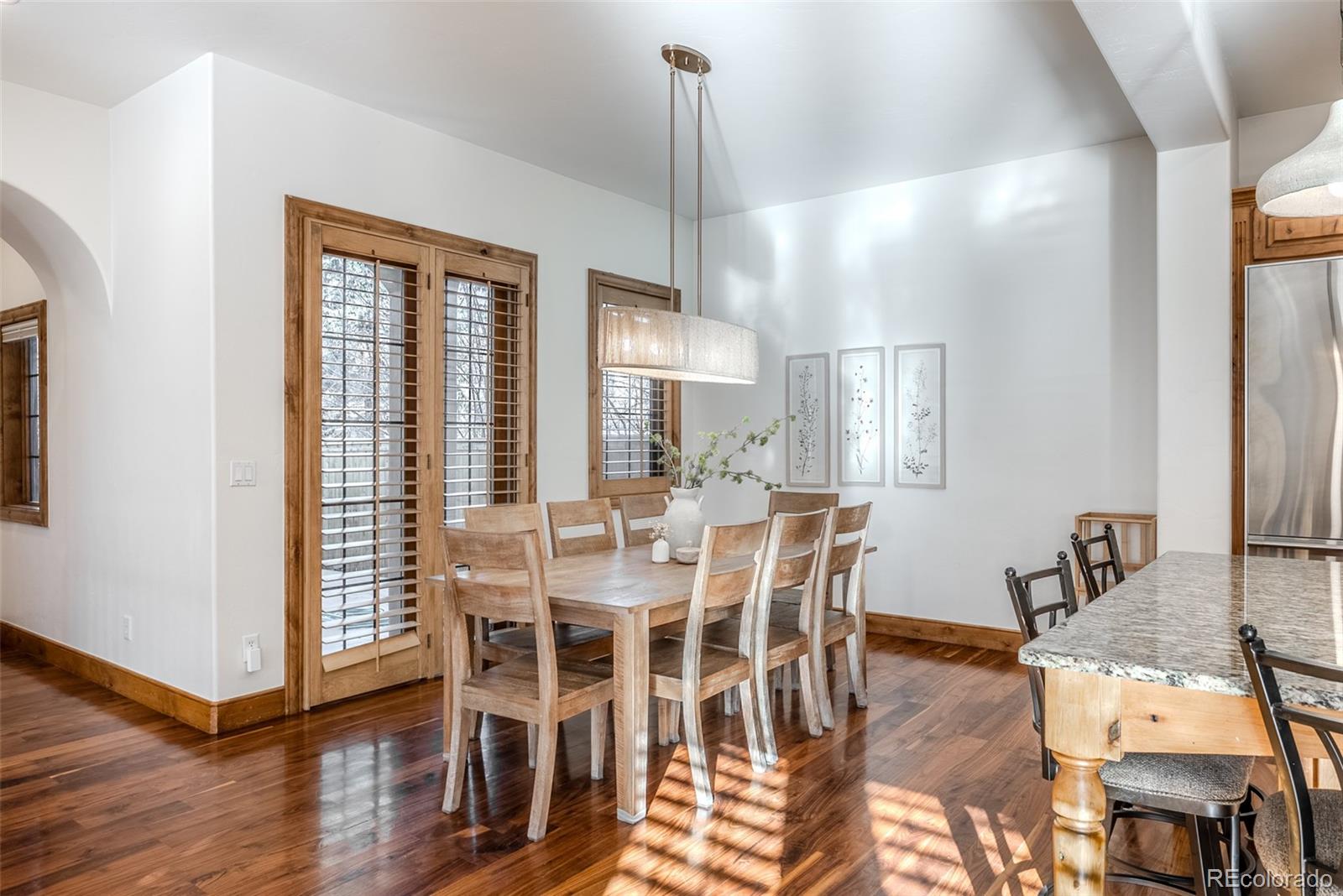 2515 South Fillmore Street Denver, CO 80210 - Photo 17 of 40 a view of a dining room with furniture window and wooden floor