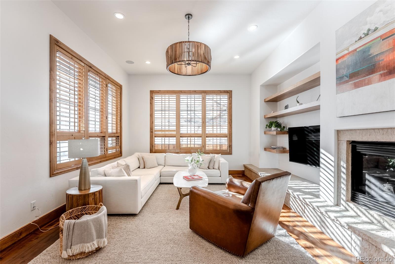 2515 South Fillmore Street Denver, CO 80210 - Photo 19 of 39 a living room with fireplace furniture and a large window