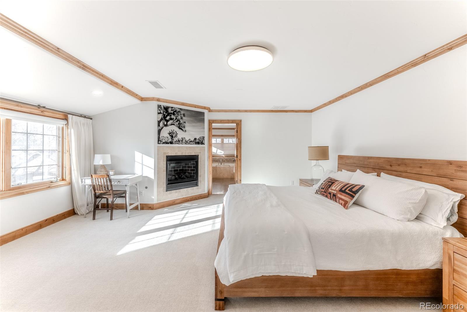 2515 South Fillmore Street Denver, CO 80210 - Photo 20 of 39 a bedroom with a bed and a couch