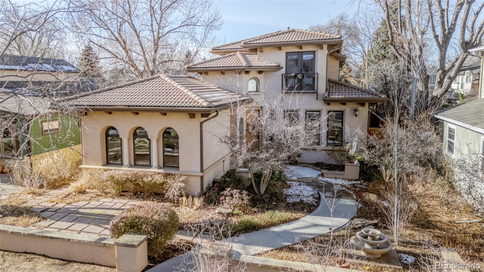 2515 South Fillmore Street Denver, CO 80210 - Photo 2 of 40 a front view of a house with garden