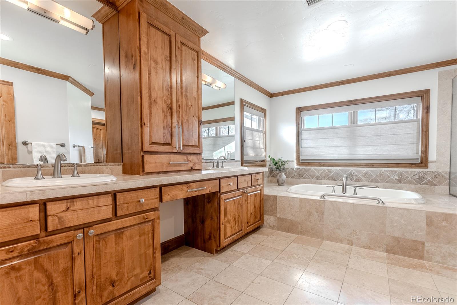 2515 South Fillmore Street Denver, CO 80210 - Photo 23 of 40 a large spacious bathroom with a large tub and sink
