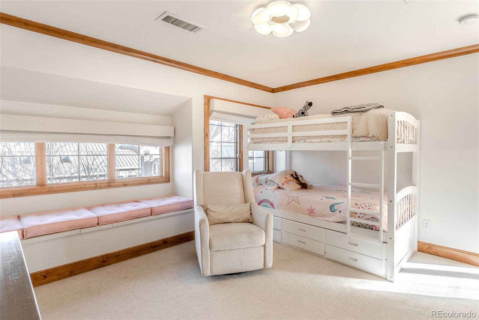 2515 South Fillmore Street Denver, CO 80210 - Photo 24 of 39 a living room with furniture and a large window