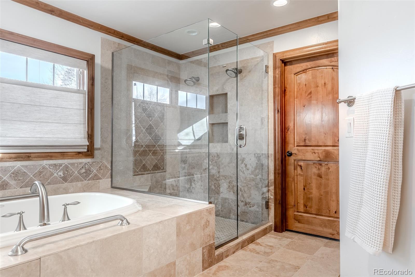 2515 South Fillmore Street Denver, CO 80210 - Photo 24 of 40 a bathroom with a tub sink shower and mirror