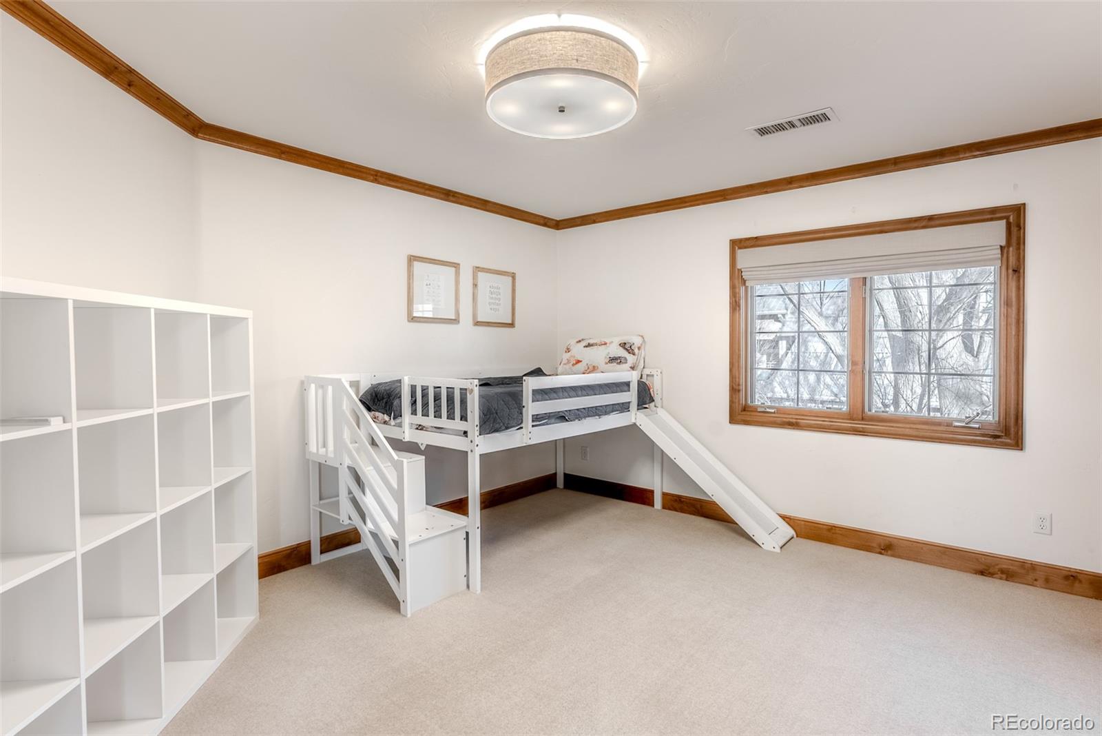 2515 South Fillmore Street Denver, CO 80210 - Photo 27 of 40 a view of a bedroom with furniture and windows