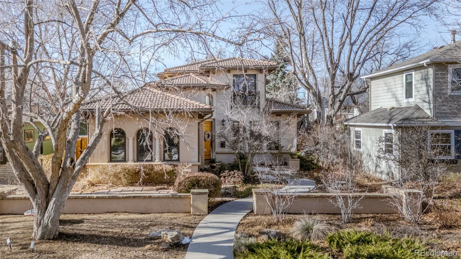 2515 South Fillmore Street Denver, CO 80210 - Photo 3 of 40 a view of a building with a yard