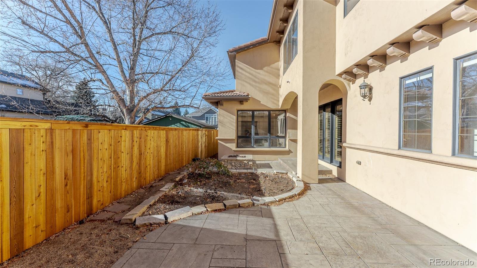 2515 South Fillmore Street Denver, CO 80210 - Photo 33 of 40 a view of a house with wooden fence