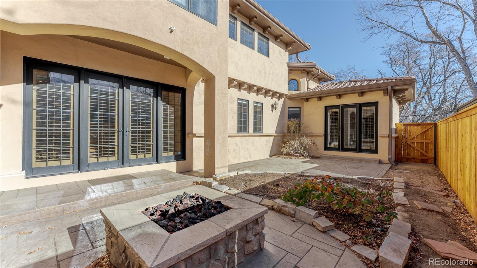 2515 South Fillmore Street Denver, CO 80210 - Photo 33 of 39 a front view of a house with a yard