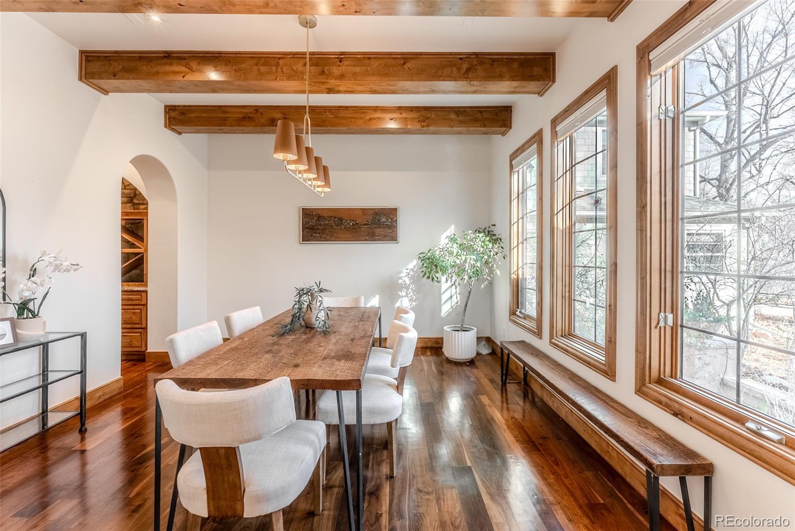 2515 South Fillmore Street Denver, CO 80210 - Photo 10 of 40 a view of a dining room with furniture and a large window