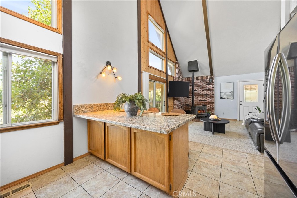 23740 Lakeview Drive Tehachapi, CA 93561 - Photo 16 of 48 a kitchen with a sink and a refrigerator