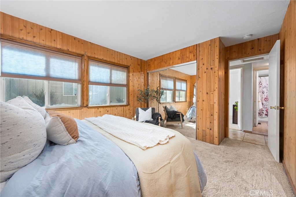 23740 Lakeview Drive Tehachapi, CA 93561 - Photo 18 of 48 a bedroom with a bed and a large window