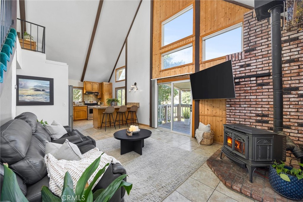 23740 Lakeview Drive Tehachapi, CA 93561 - Photo 6 of 48 a living room with furniture a flat screen tv and a large window