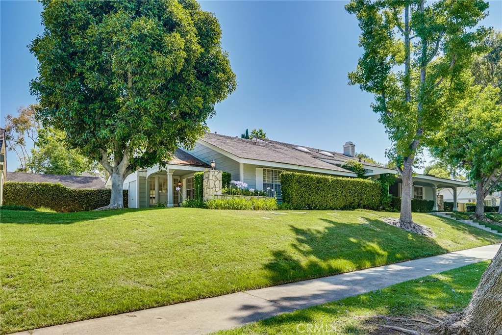 49 East Yale Loop, Unit 26 Irvine, CA 92604 - Photo 1 of 63 a front view of a house with a yard
