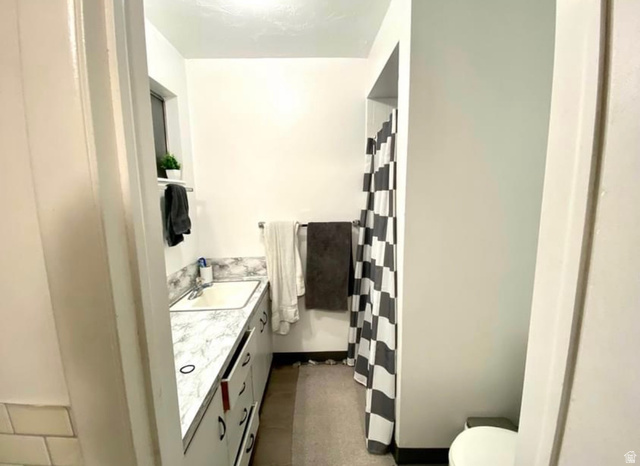 640 East 600 North Logan, UT 84321 - Photo 17 of 20 Bathroom with vanity and curtained shower