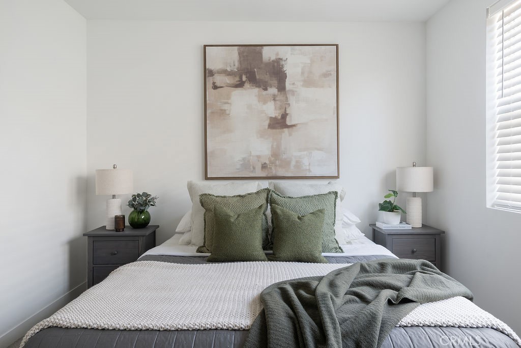 1300 Lasso Way, Unit 305 Rancho Mission Viejo, CA 92694 - Photo 12 of 36 a bedroom with a bed and a painting on the wall