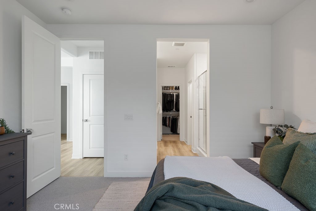 1300 Lasso Way, Unit 305 Rancho Mission Viejo, CA 92694 - Photo 14 of 36 a bedroom with a bed and furniture