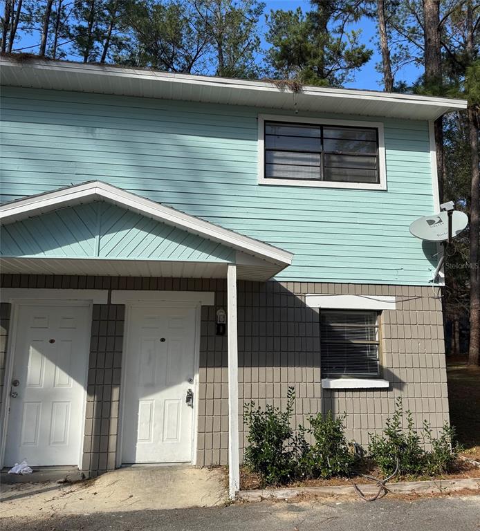 7130 Southwest 45th Place, Unit B Gainesville, FL 32608 - Photo 1 of 1 a house view with a swimming pool