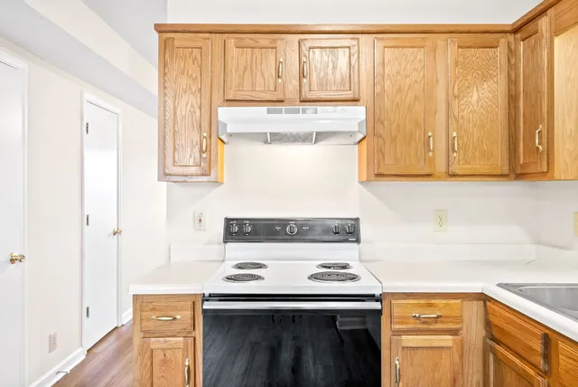 a kitchen with a stove and a microwave