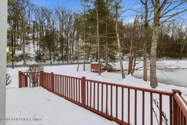 a view of a fence and trees