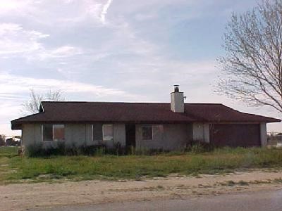 14100 Havasu Road Apple Valley, CA 92307 - Photo 1 of 1 a front view of a house with a yard
