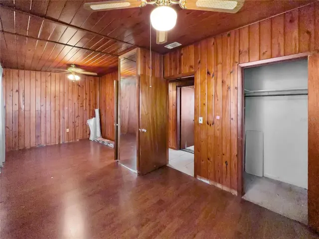 a view of a porch with wooden floor and iron walls