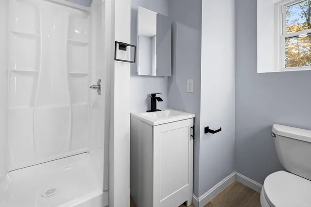 a bathroom with a toilet and a sink