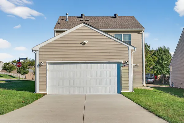 a front view of house with a yard