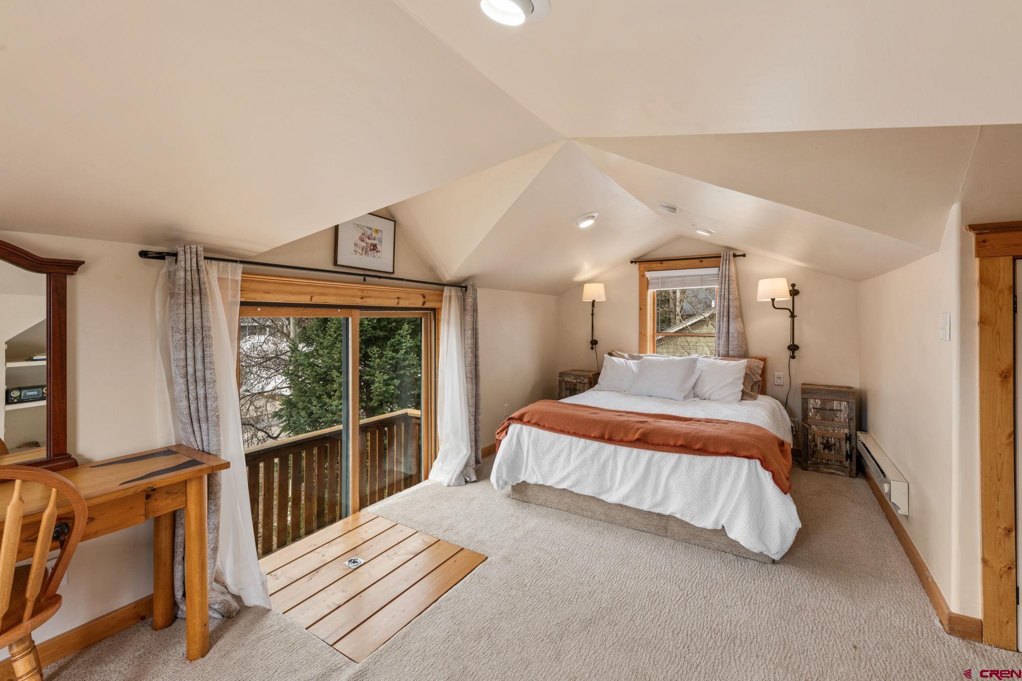 31 Gothic Avenue Crested Butte, CO 81224 - Photo 20 of 33 a bedroom with a large bed and a large window