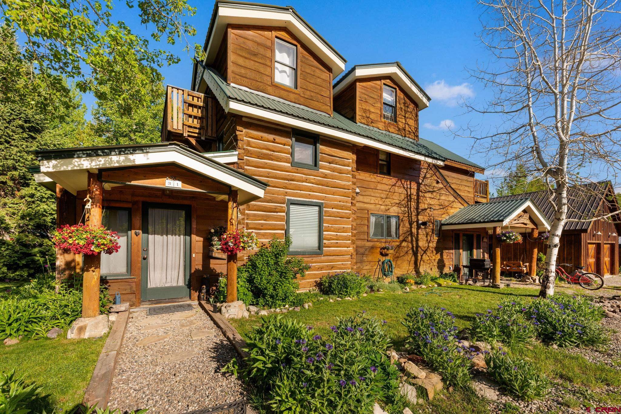 31 Gothic Avenue Crested Butte, CO 81224 - Photo 2 of 33 front view of a house with a small yard