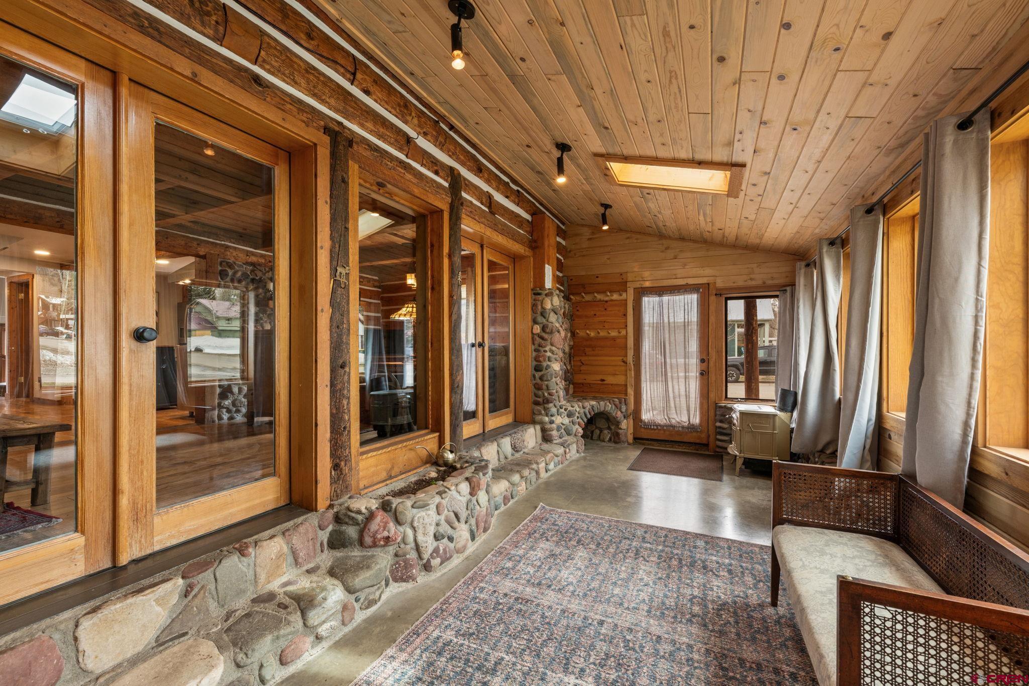 31 Gothic Avenue Crested Butte, CO 81224 - Photo 5 of 33 a living room with furniture and large windows
