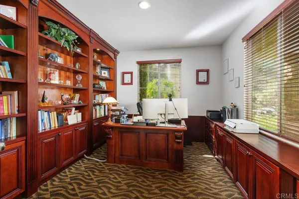 a kitchen with stainless steel appliances a sink window and cabinets