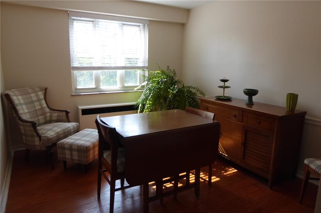 4601 Fifth Avenue, Unit 623 Pittsburgh, PA 15213 - Photo 13 of 28 a room with furniture and wooden floor