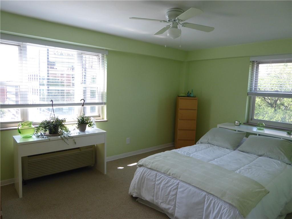 4601 Fifth Avenue, Unit 623 Pittsburgh, PA 15213 - Photo 16 of 28 a bedroom with a bed and window