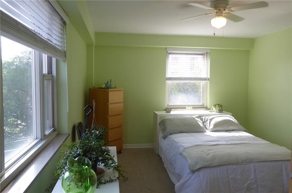 4601 Fifth Avenue, Unit 623 Pittsburgh, PA 15213 - Photo 17 of 28 a bedroom with a bed and a window