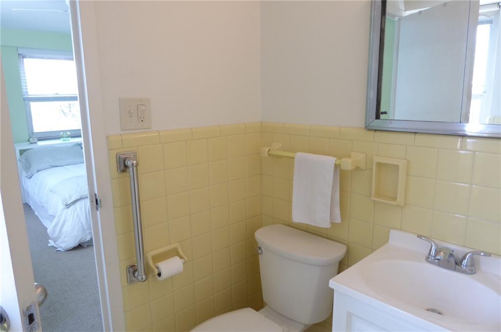 4601 Fifth Avenue, Unit 623 Pittsburgh, PA 15213 - Photo 19 of 28 a white toilet sitting next to a bathroom sink