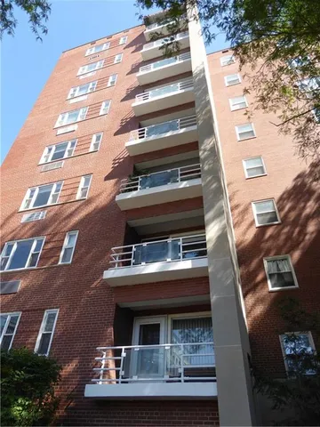a view of a building with a street